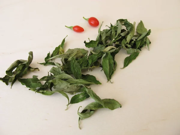 Dried Goji Leaves Wooden Board — Stock Photo, Image