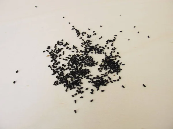 Semillas Alcaravea Negra Una Tabla Madera —  Fotos de Stock