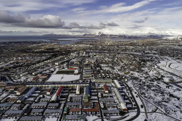 Aerial view of Reykjavik city and Esjan in winter — Stock Image Aerial view of Reykjavik city and Esjan in winter Stock Image