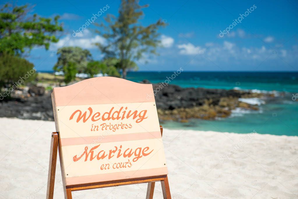 beach wedding sign on a beach