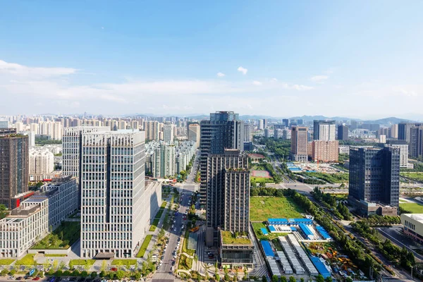 skyscrapers of a modern city with overlooking perspective under blue sky