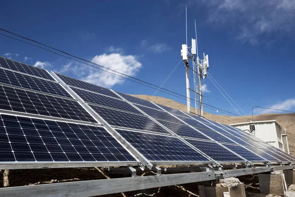 solar panels with base station on mountain in Tibet