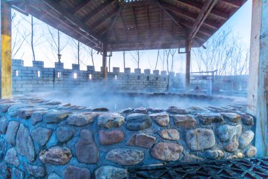 hot springs outdoor in Jilin city at night clipart