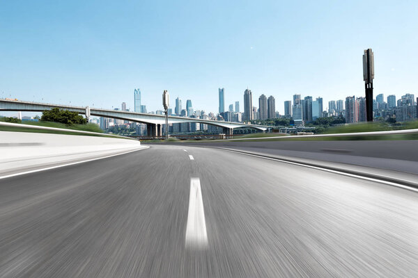 Empty highway through modern city