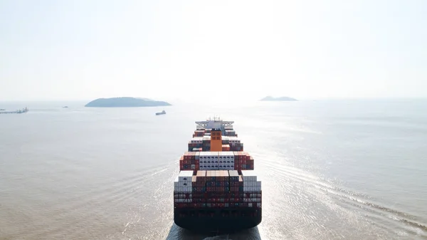 Aerial top view container cargo ship in import export business logistic and transportation of international by container cargo ship in the open sea