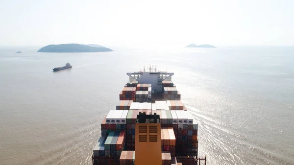 Aerial top view container cargo ship in import export business logistic and transportation of international by container cargo ship in the open sea