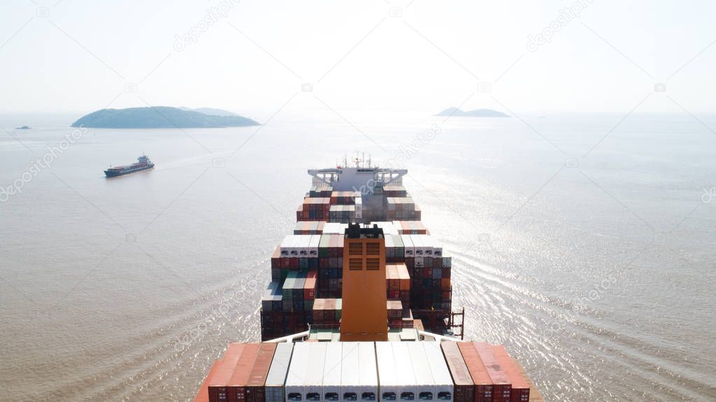 Aerial top view container cargo ship in import export business logistic and transportation of international by container cargo ship in the open sea