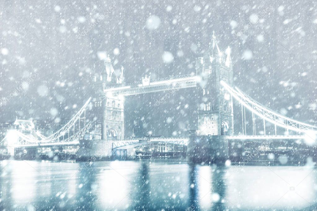 View of Tower Bridge in London with snow by night