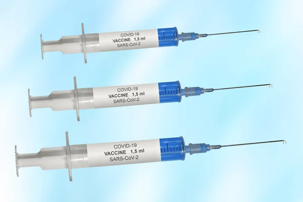Three Covid Vaccination Syringes Front Blue Background — Stock Photo, Image