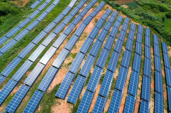 aerial view of photovoltaic panels on hillside , renewable energy for solar power