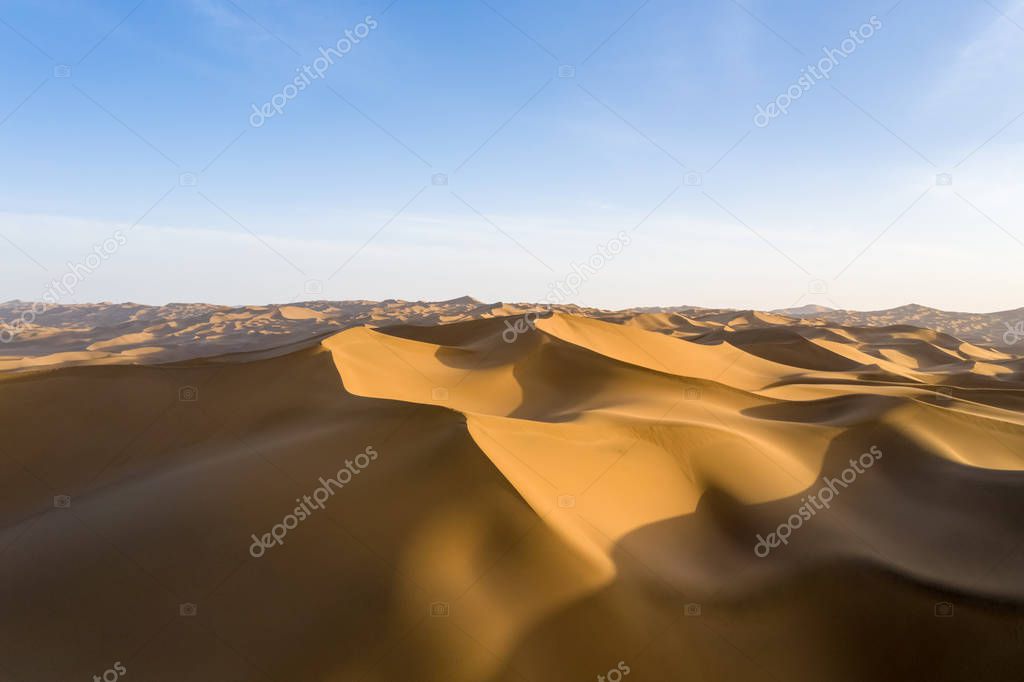 desert dusk landscape, setting sun shine over the dunes