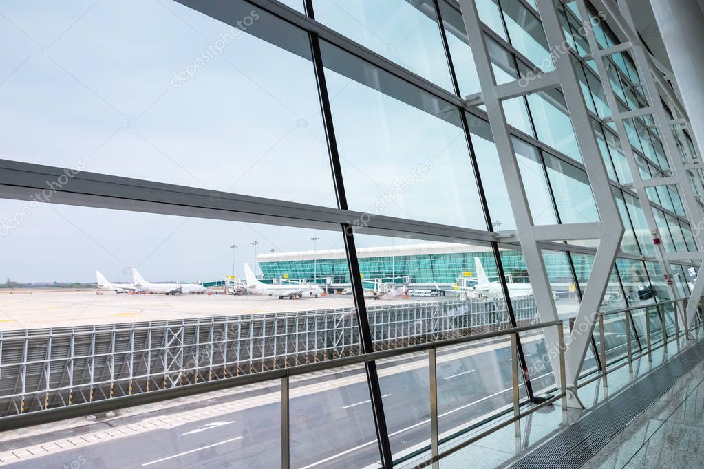 modern airport scene, view of outside the terminal window