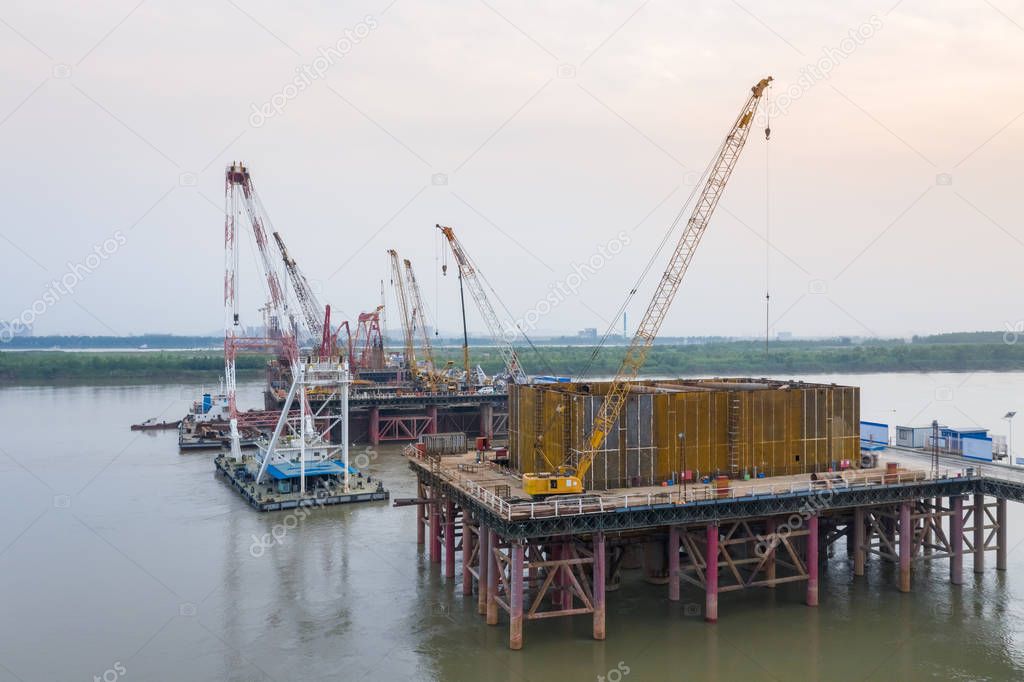 cranes on bridge construction site