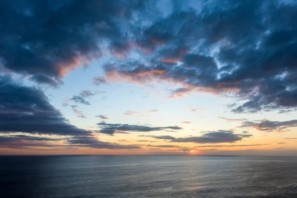 Beautiful sunset clouds over the sea — Stock Photo, Image