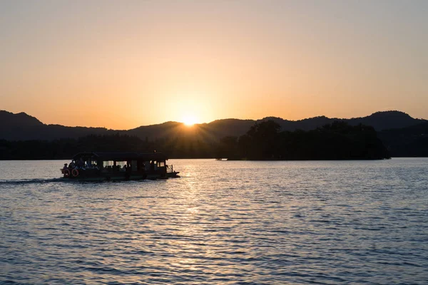 hangzhou west lake in sunset