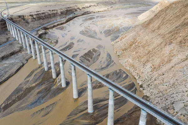 Aerial view of railroad bridge on kunlun river — Stock Photo, Image