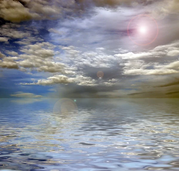 reflection of a beautiful blue sky in a calm sea surface