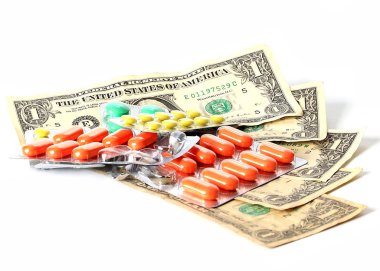 tabletler ve hapları Amerikan kağıt dolar üzerinde ücretli Tıp sembolü olarak.