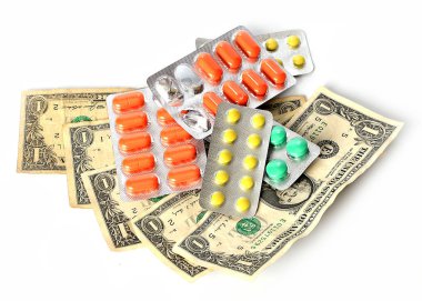 tabletler ve hapları Amerikan kağıt dolar üzerinde ücretli Tıp sembolü olarak.
