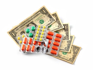 tabletler ve hapları Amerikan kağıt dolar üzerinde ücretli Tıp sembolü olarak.