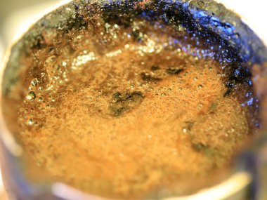 coffee foam on the surface of the drink during preparation