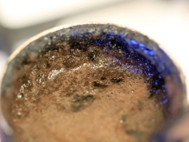coffee foam on the surface of the drink during preparation
