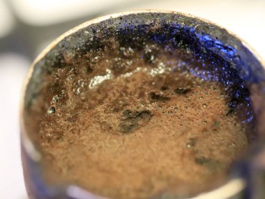 coffee foam on the surface of the drink during preparation