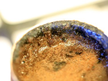 coffee foam on the surface of the drink during preparation