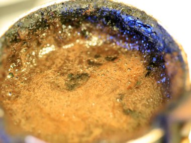 coffee foam on the surface of the drink during preparation