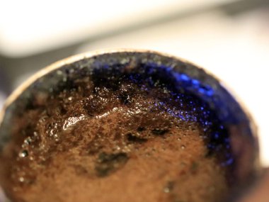 coffee foam on the surface of the drink during preparation