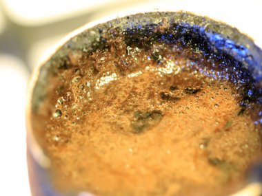coffee foam on the surface of the drink during preparation