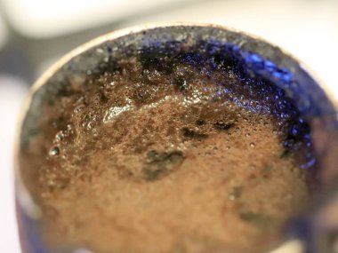 coffee foam on the surface of the drink during preparation