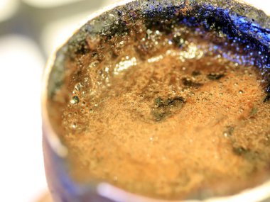 coffee foam on the surface of the drink during preparation