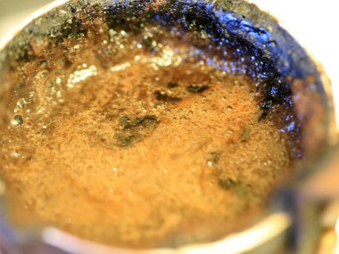 coffee foam on the surface of the drink during preparation