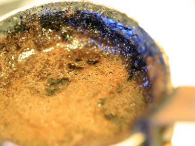 coffee foam on the surface of the drink during preparation