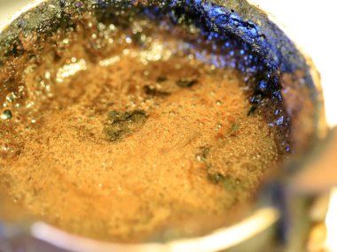 coffee foam on the surface of the drink during preparation