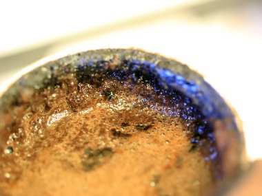 coffee foam on the surface of the drink during preparation