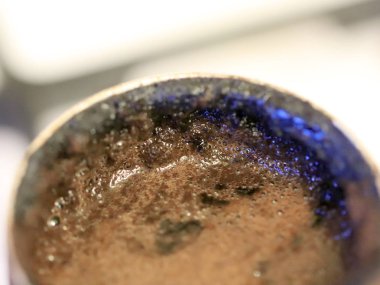 coffee foam on the surface of the drink during preparation