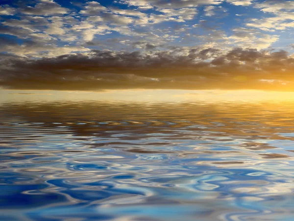 reflection of the sunny cloudy sky in the calm surface of the reservoir