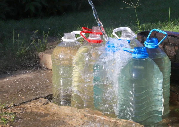 Pouring Clear Water Plastic Bottles — Stock Photo, Image