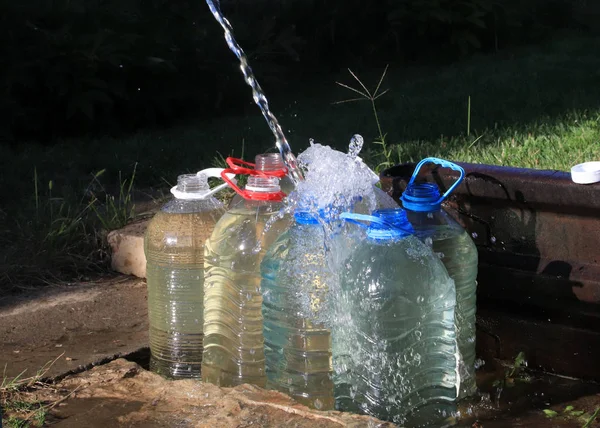 Pouring Clear Water Plastic Bottles — Stock Photo, Image