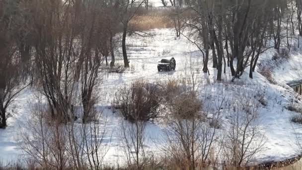 Car Snowy Road Woods Pond — Stock Video