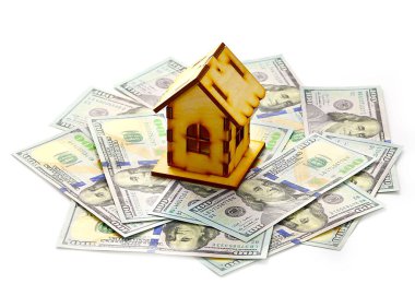 ahşap ev kağıt faturaları dolar yığını üzerinde ipotek bir sembolü olarak duruyor.