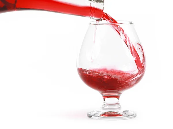 Μοτίβα Του Κόκκινου Κρασιού Όταν Διοχετεύονται Ένα Ποτήρι — Φωτογραφία Αρχείου
