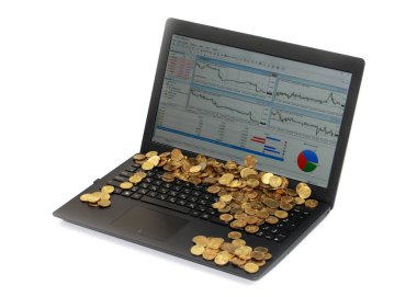 dizüstü bilgisayar ekranında hisse senedi tırnak ve altın sikke bir demet
