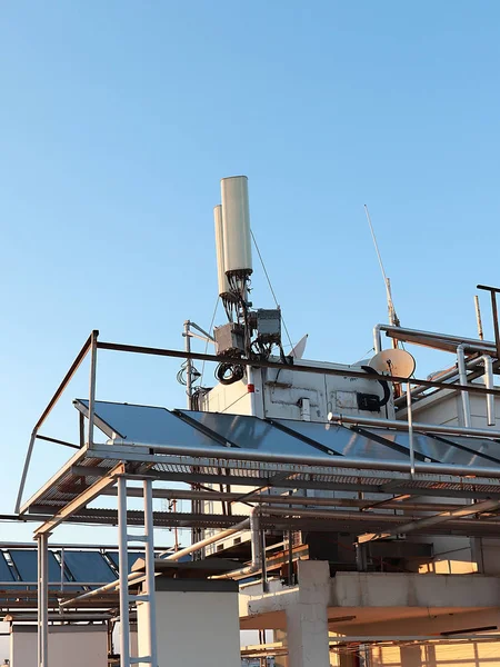 telecommunication equipment installed on the roof of the city building