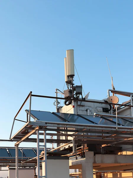 telecommunication equipment installed on the roof of the city building