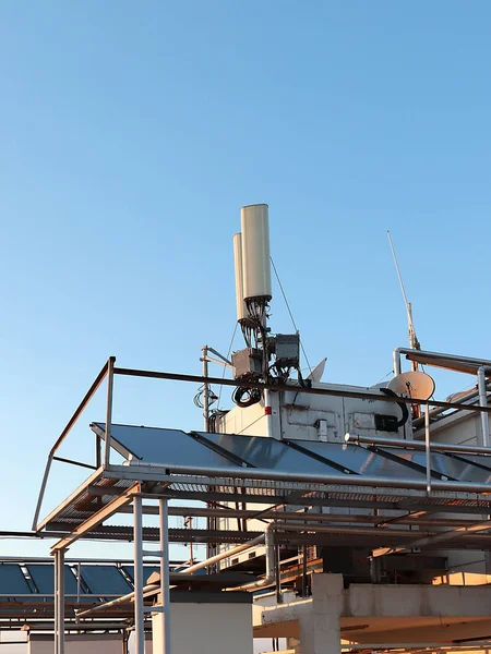 telecommunication equipment installed on the roof of the city building