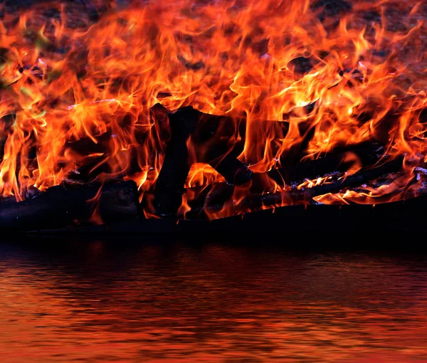 Reflection Bright Flame Calm Water Surface — Stock Photo, Image