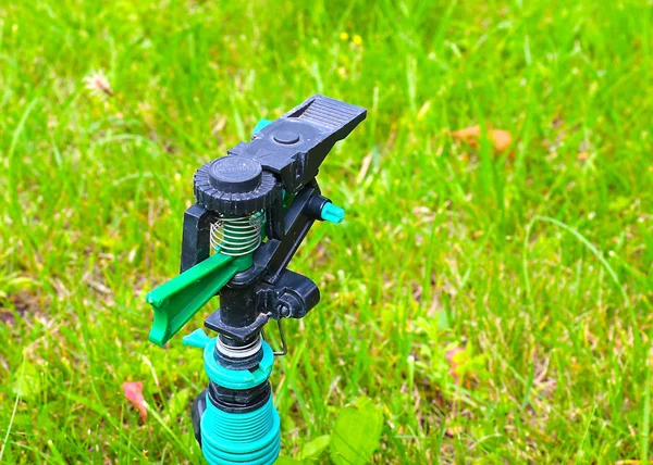 Plastic Sprayer Watering Lawn Grass — Stock Photo, Image